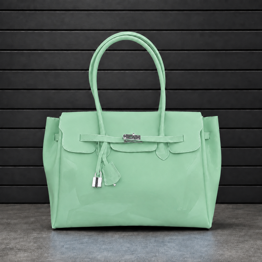 Sac à main Jelly Firkin Pistachio en PVC effet gelée vert pistache, fermoir cadenas argenté et anses rondes surpiquées
