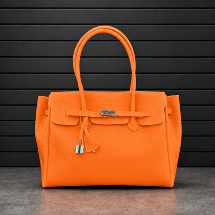 Sac à main Jelly Firkin Sunset en PVC effet gelée orange coucher de soleil, fermoir cadenas argenté et anses rondes surpiquées