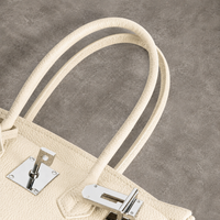 Anses et ferrure argentée du sac Jelly Élan Ivoire vues du dessus, cuir véritable grainé